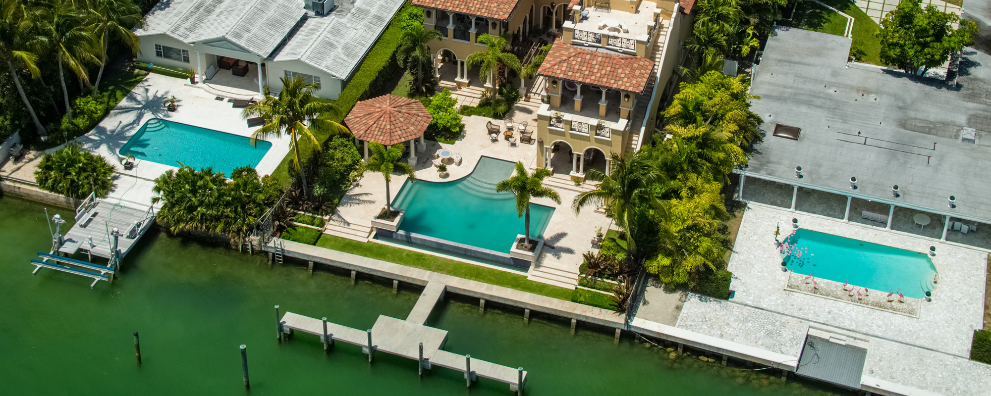 aerial view of luxury homes along water