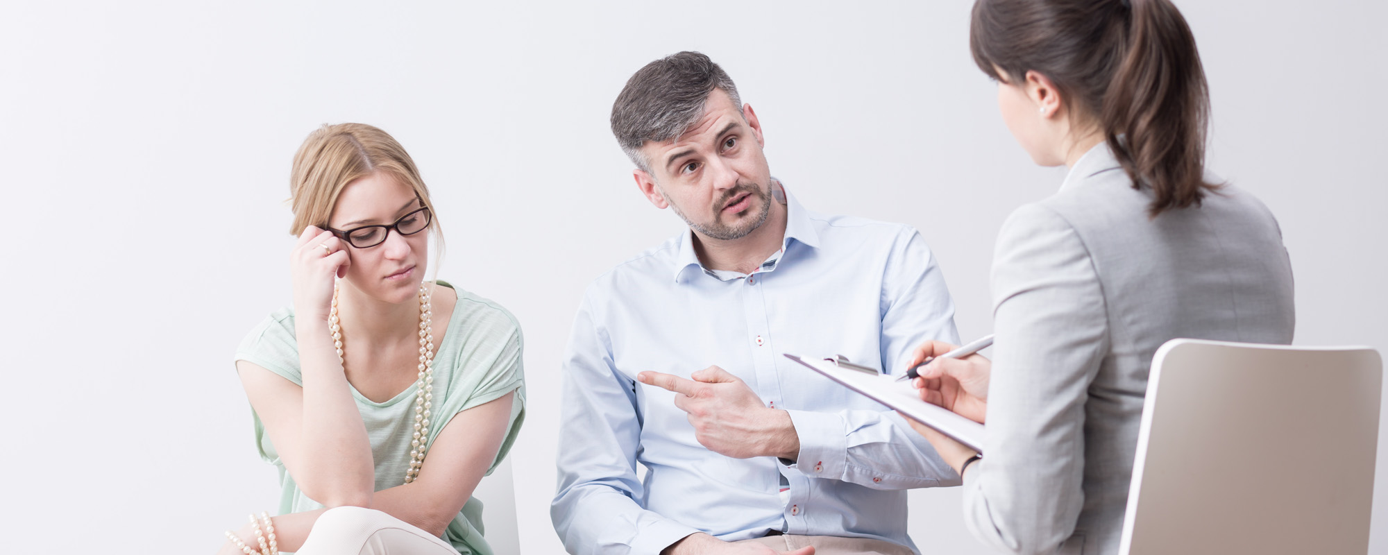 couple during a therapy session sitting in a very bright room