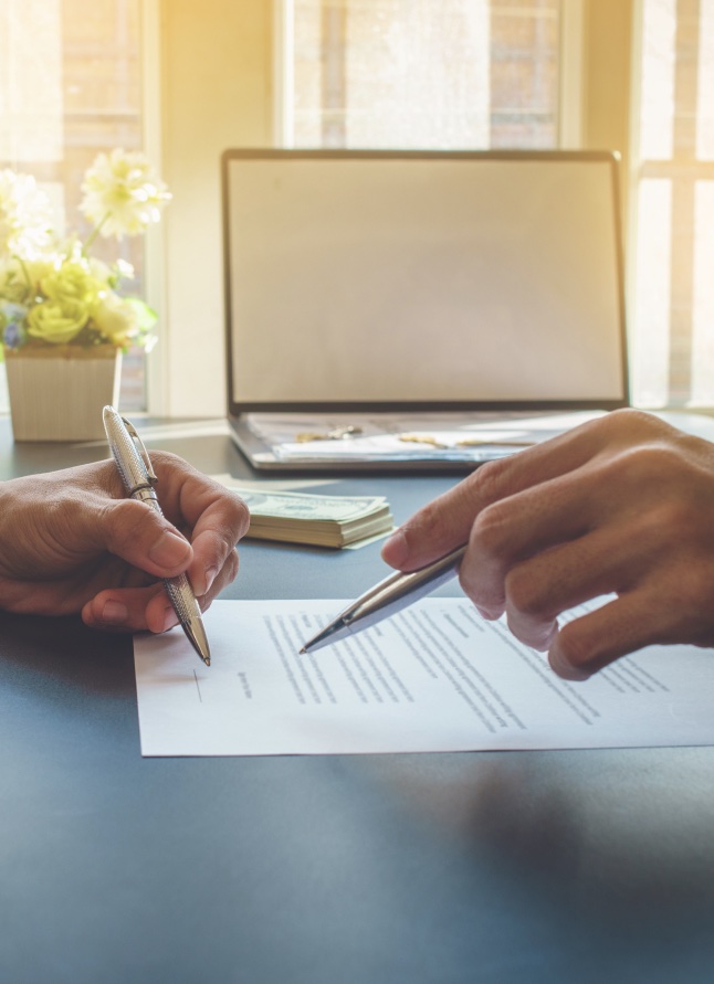 photo of person signing legal document