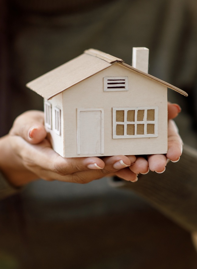 picture of model home in hands