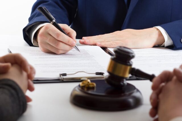 lawyer signing a document