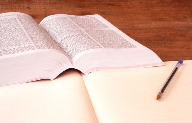 open book and pen on a table