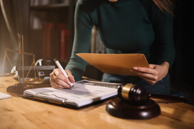 Lawyer singing in documents, filling court records, job responsibilities in office.